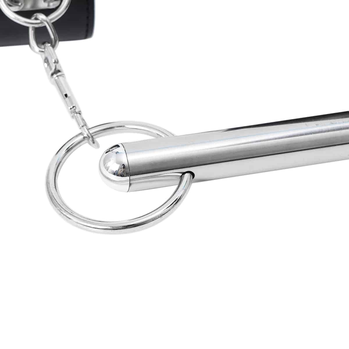 Ideal Leather wrist and neck cuffs attached to a metal bar, showcasing leather restraints for bondage and BDSM activities.