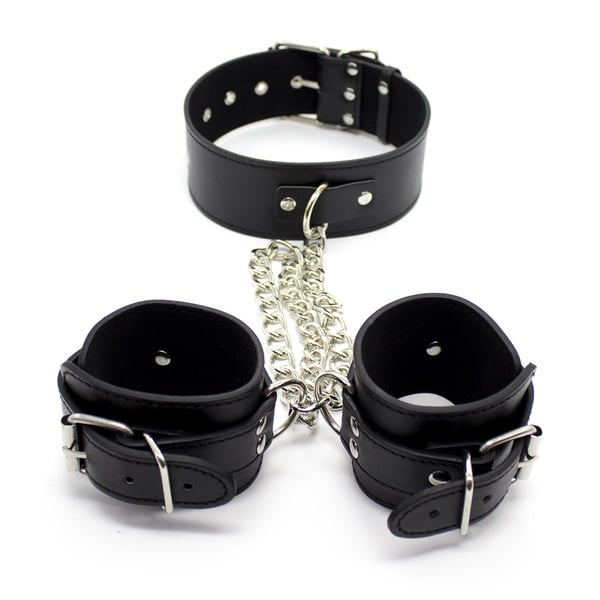 Black leather collar and handcuffs set from Ideal Leather, featuring sturdy straps and secure metal fastenings.