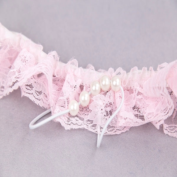 Luvland lace G-string with pearl embellishments, featuring delicate floral lace and small pearl accents on the front.