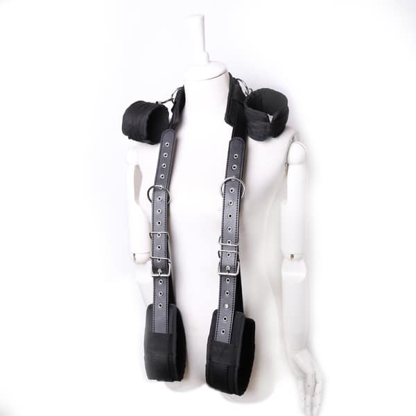 Black thigh and handcuffs restraint set by Ideal Leather, featuring adjustable straps and metal hardware for secure bondage play.