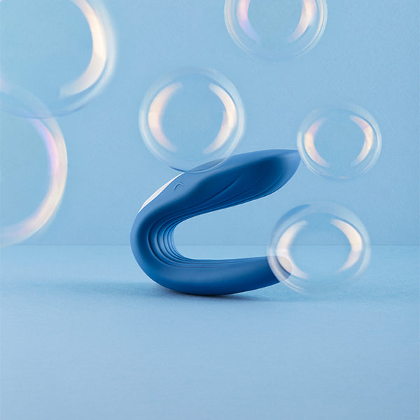 Satisfyer Double Whale Blue sexual wellness device with dual stimulation, featuring a sleek blue design and ergonomic shape.