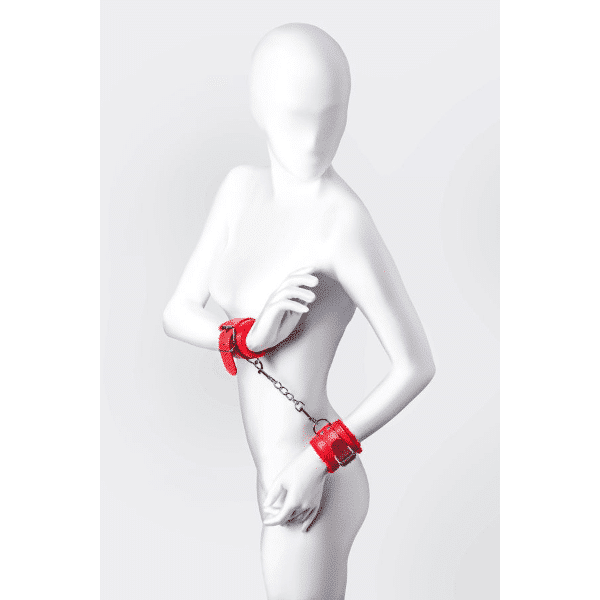 Red Toyfa Anonymo Wrist Cuffs with adjustable straps and metal hardware for bondage play.