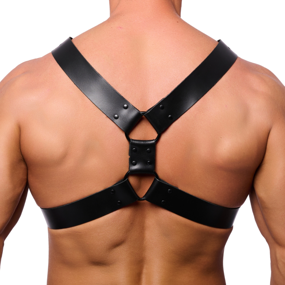 Black leather chest harness by Luvland featuring adjustable straps and metal hardware for a bold, edgy look.