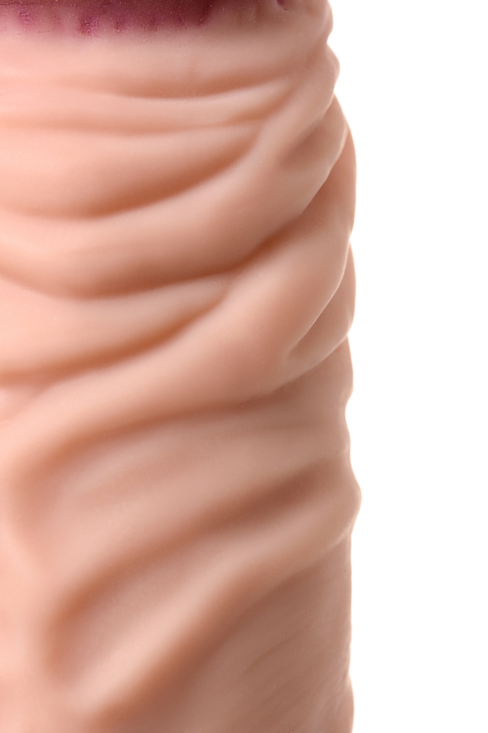 Toyfa Toys Rican 22.5cm multi-speed flesh-colored vibrator, showing the textured body and control buttons.