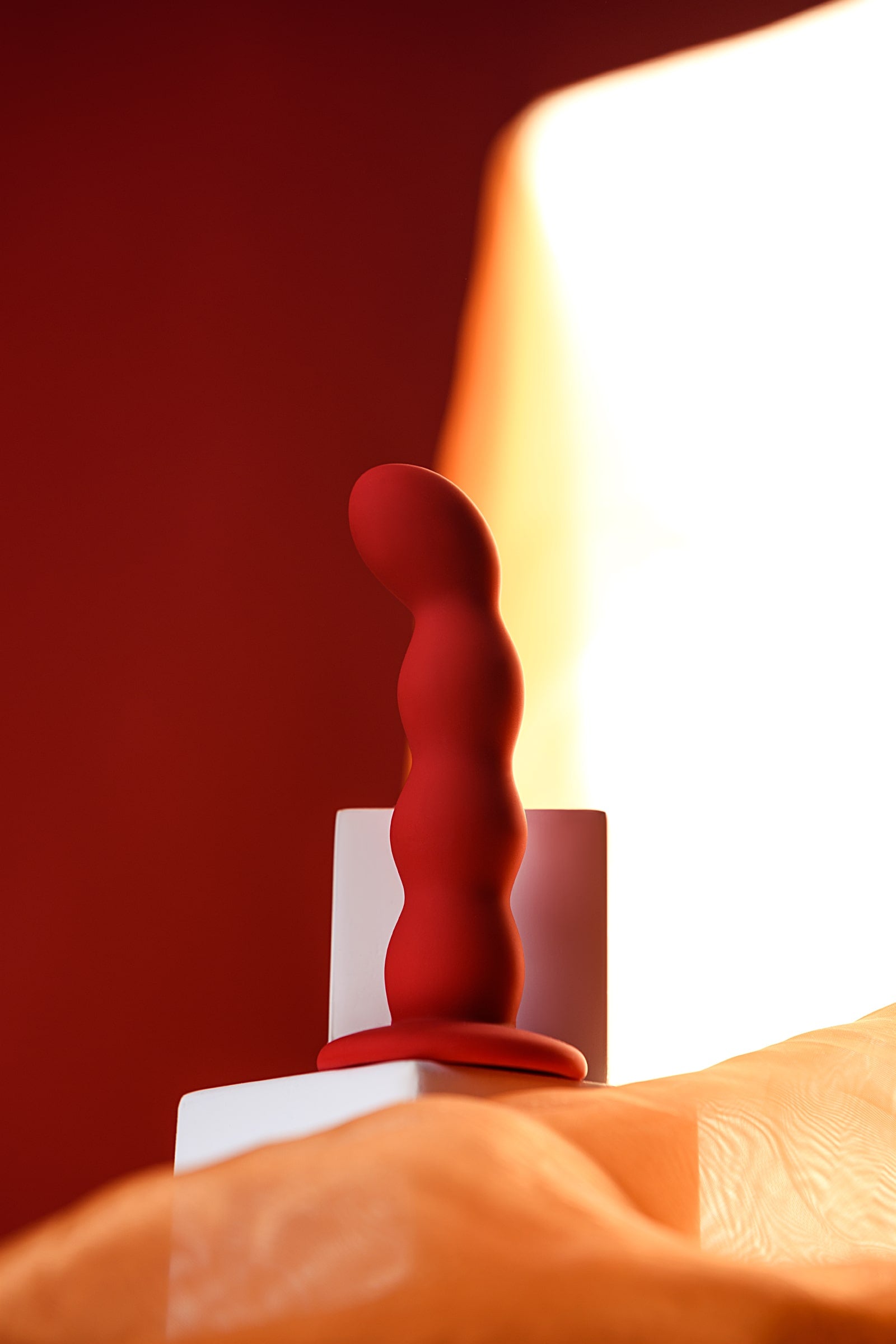 Luvland To Do Favorite Anal Wand in red, smooth silicone with multiple graduated sizes for comfortable anal exploration.