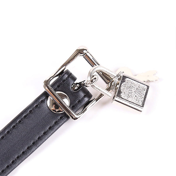 Purple gag with chained nipple clamps from Ideal Leather, featuring a secure strap and metal chain for BDSM restraint.