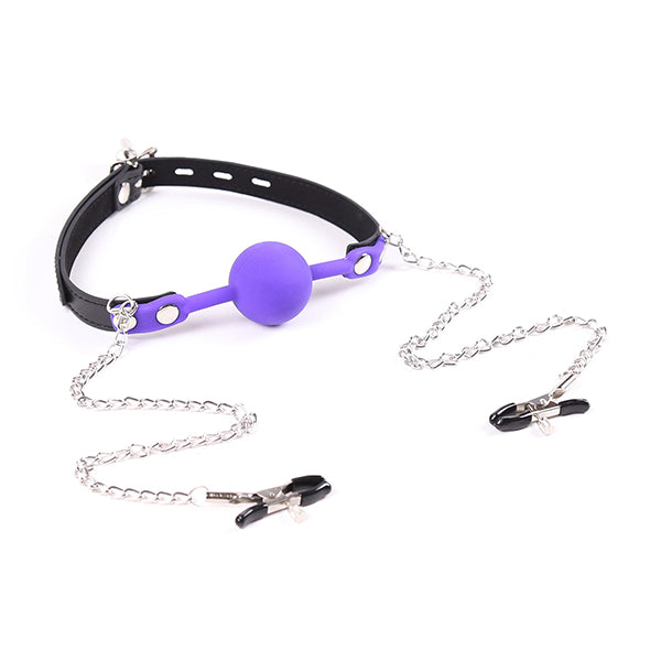Purple gag with chained nipple clamps from Ideal Leather, featuring a leather strap and metal chain, designed for BDSM play.