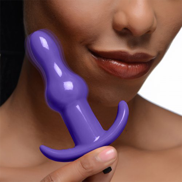 Purple Frisky Bumpy Anal Plug by Luvland, featuring a rolling textured design in deep purple color.