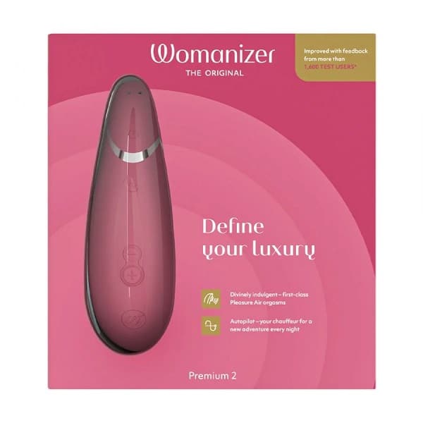 Womanizer Premium 2 personal pleasure device with raspberry-colored exterior, shown with sleek design and internal features visible.