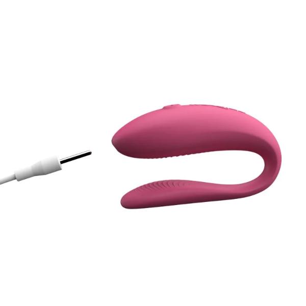 Pink We Vibe Sync Lite couples vibrator by Luvland, shown with smooth silicone surface and ergonomic design for intimate pleasure.