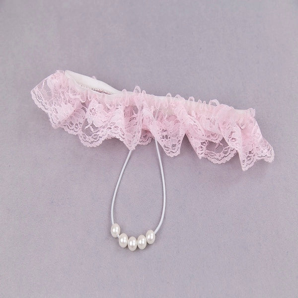 Luvland lace G-string with pearl embellishments, featuring delicate floral lace and small pearl accents for elegant lingerie.