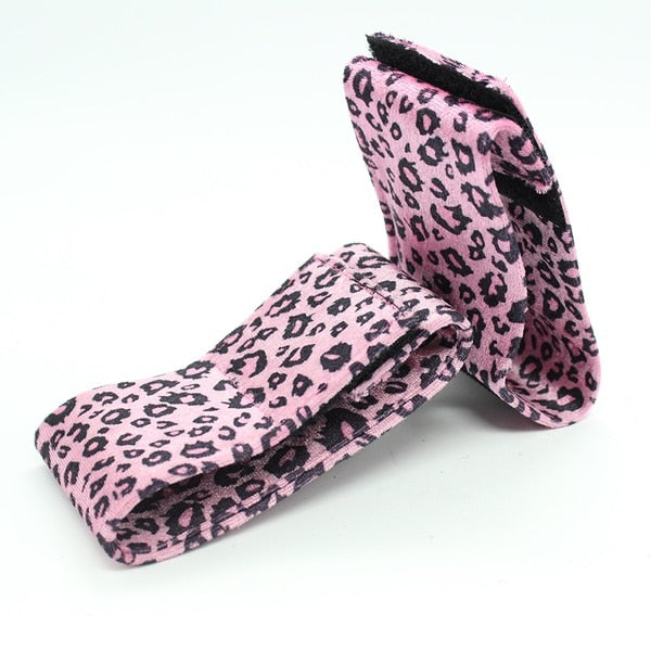 Pink leopard print blindfold with matching leather wrist and ankle cuffs by Ideal Leather, designed for sensory play and restraint.
