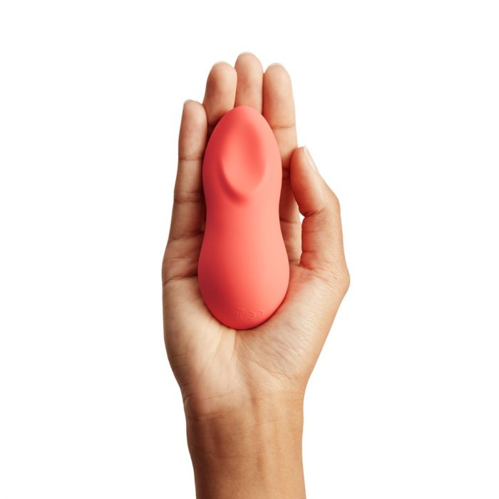 Luvland We Vibe Touch X Coral personal massager with smooth, ergonomic design and coral color for intimate pleasure and relaxation.