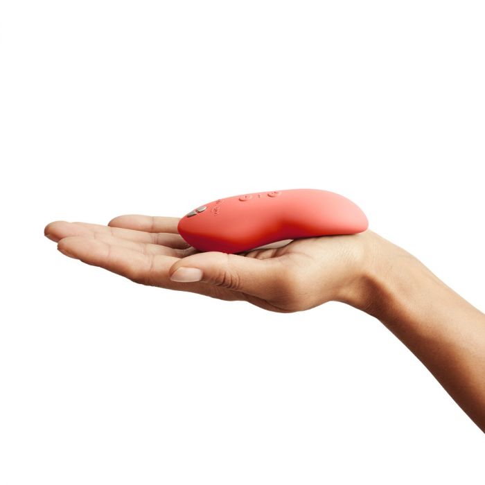Luvland We Vibe Touch X Coral personal massage vibrator with smooth, ergonomic design and coral-colored exterior.