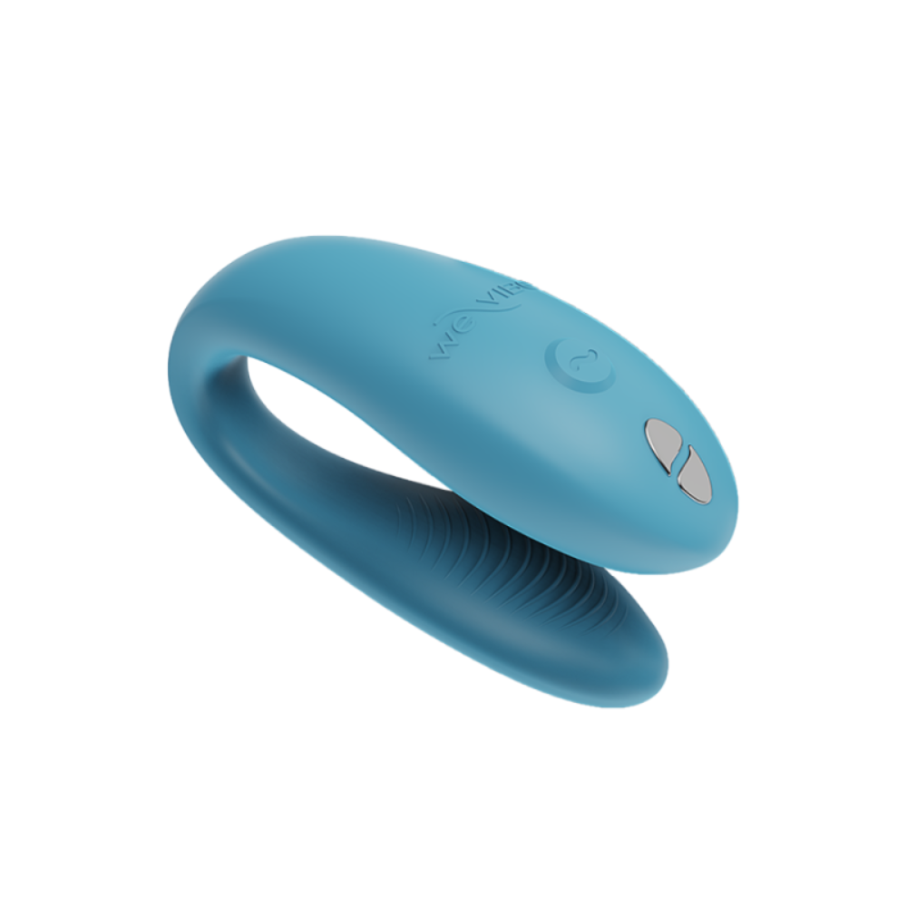 We Vibe Sync Go couples vibrator shown with its sleek black remote control and charging case, designed for remote intimacy.