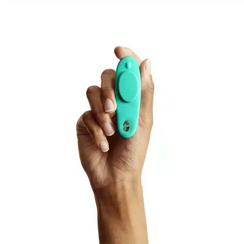 Luvland We Vibe Moxie and clitoral stimulator in aqua, compact design with vibrate functions, shown on a white background.