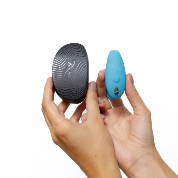 Blue We Vibe Sync Go couples vibrator with ergonomic design, shown in a close-up image highlighting its sleek shape.