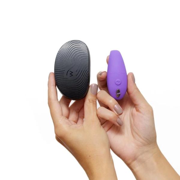 We Vibe Sync Go in purple, showcasing its compact, ergonomic design with adjustable tips for enhanced intimacy and comfort.
