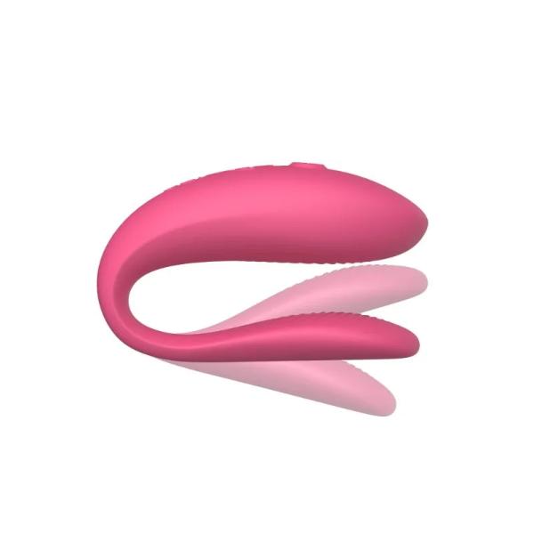Pink We Vibe Sync Lite couple's vibrator by Luvland with adjustable arms and remote control for shared pleasure.
